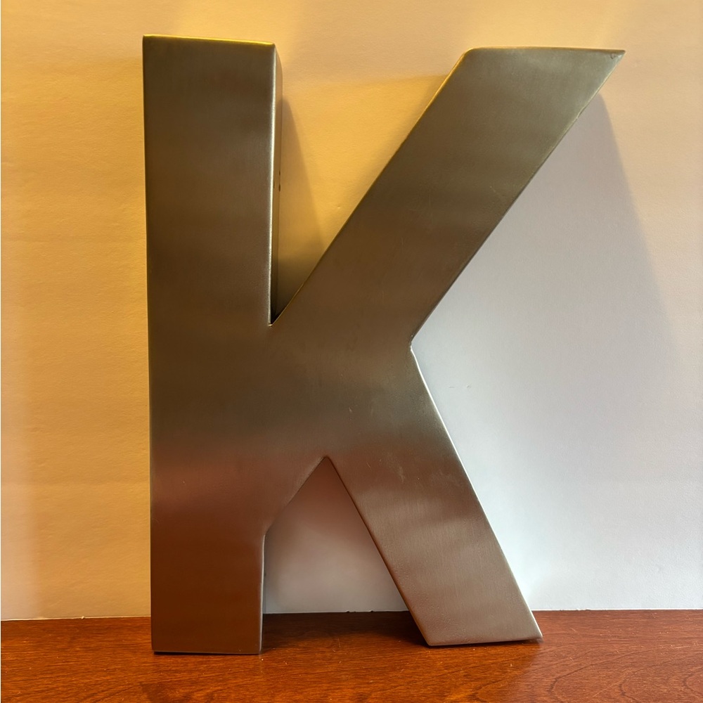 The Letter K in Metal